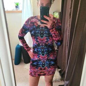 Bright trippy long-sleeved mini dress. Very stretchy. Size large.